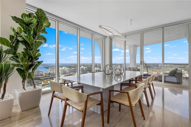 sunroom featuring plenty of natural light and a city view