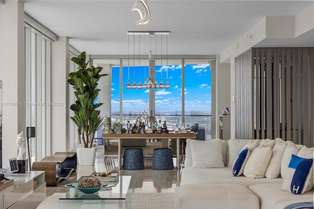living room featuring expansive windows and wood finished floors