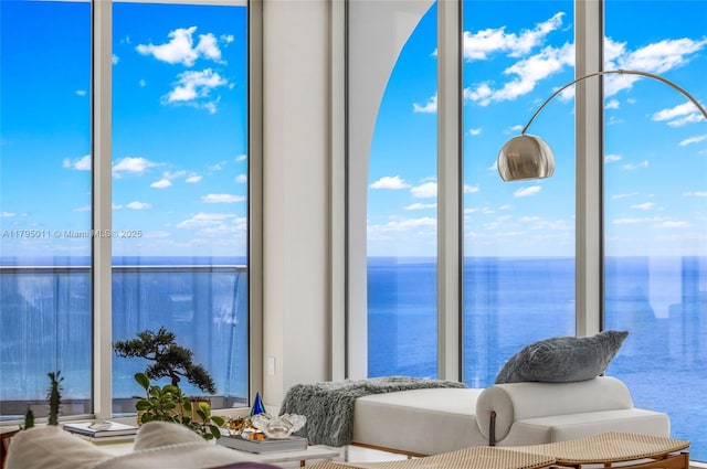 interior space featuring a water view and a healthy amount of sunlight
