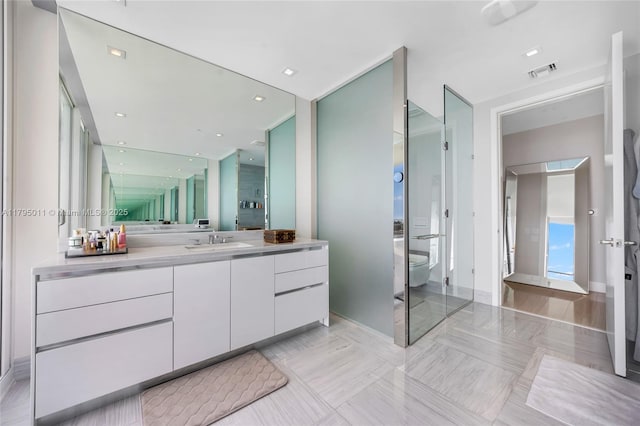 bathroom featuring visible vents and vanity