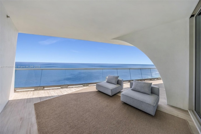 balcony featuring a water view