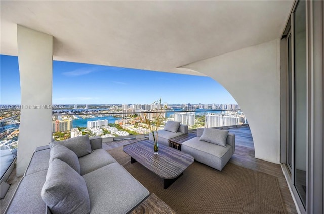balcony with a view of city and a water view