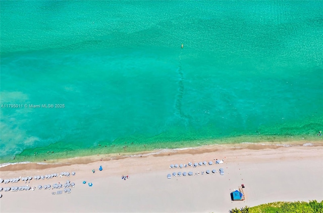 bird's eye view featuring a beach view and a water view