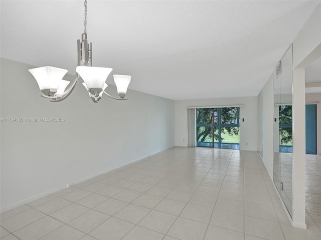 3501 Bimini Ln Unit K2, Coconut Creek, FL 33066 - unfurnished room featuring visible vents, light tile patterned flooring, and a notable chandelier