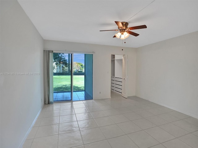3501 Bimini Ln Unit K2, Coconut Creek, FL 33066 - spare room with light tile patterned floors, baseboards, and ceiling fan