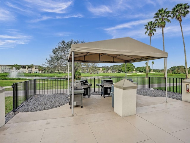 3501 Bimini Ln Unit K2, Coconut Creek, FL 33066 - view of patio / terrace with fence, a detached carport, a gazebo, and a grill