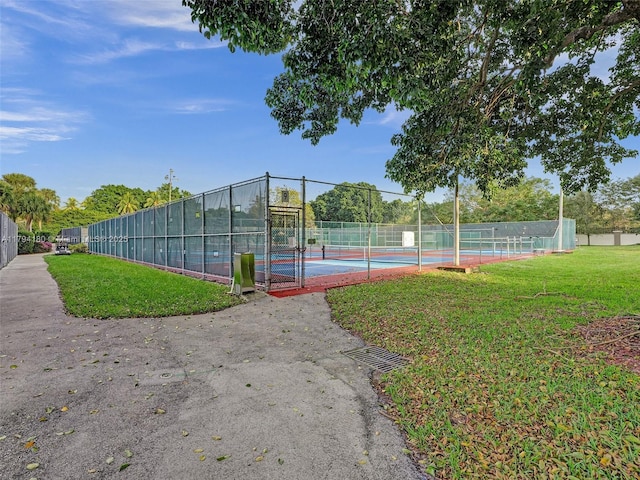 3501 Bimini Ln Unit K2, Coconut Creek, FL 33066 - view of sport court featuring a yard and fence