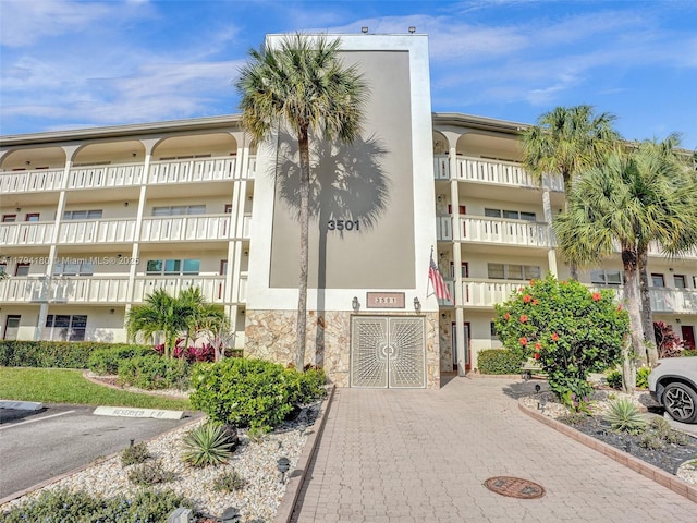 3501 Bimini Ln Unit K2, Coconut Creek, FL 33066 - view of building exterior featuring uncovered parking