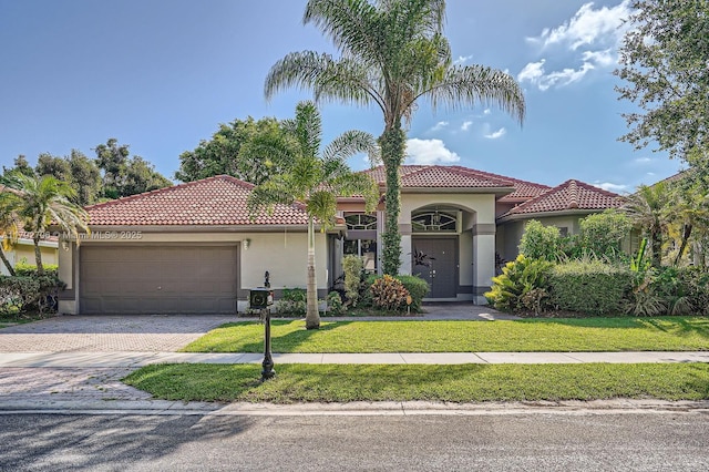 1081 SW 156th Ave, Pembroke Pines, FL 33027 - mediterranean / spanish-style house with stucco siding, an attached garage, driveway, and a tiled roof