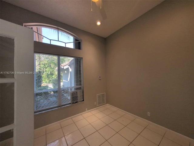 tiled empty room with recessed lighting, ceiling fan, and visible vents