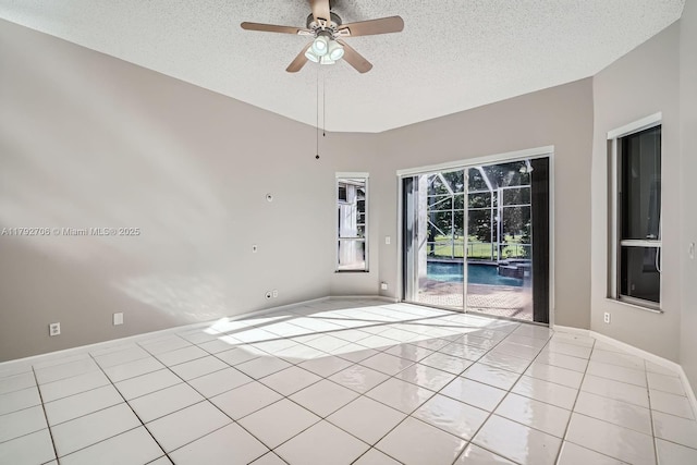 1081 SW 156th Ave, Pembroke Pines, FL 33027 - unfurnished room with a textured ceiling, ceiling fan, tile patterned flooring, and baseboards