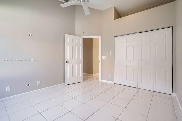 1081 SW 156th Ave, Pembroke Pines, FL 33027 - unfurnished bedroom with high vaulted ceiling, light tile patterned flooring, baseboards, a closet, and a ceiling fan