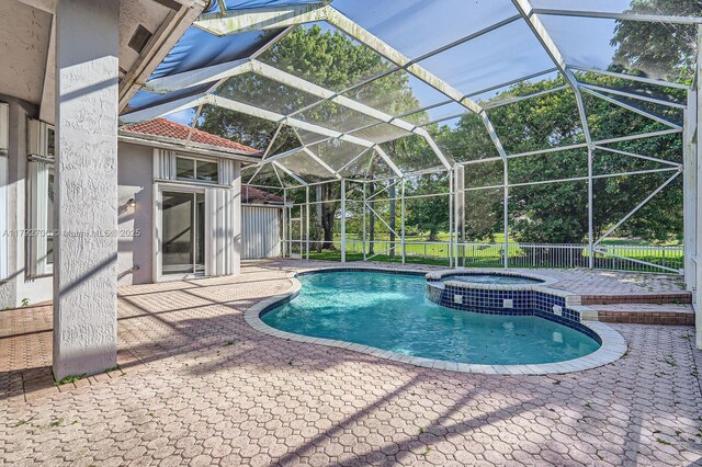 1081 SW 156th Ave, Pembroke Pines, FL 33027 - view of swimming pool featuring a patio area, a pool with connected hot tub, and glass enclosure
