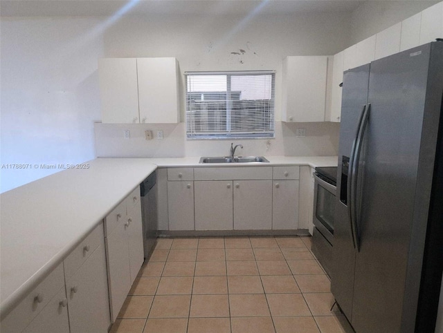 kitchen featuring light countertops, stainless steel appliances, white cabinetry, and a sink