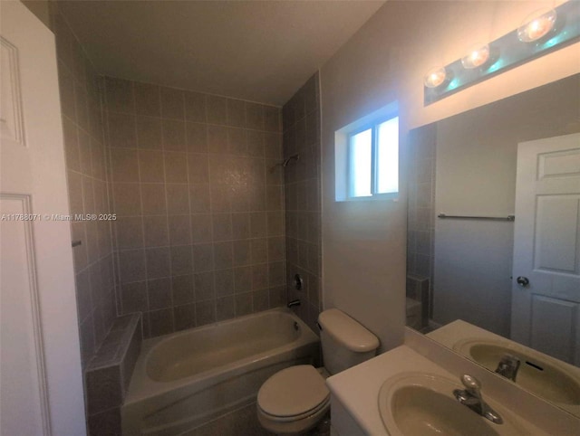bathroom with vanity, bathing tub / shower combination, and toilet