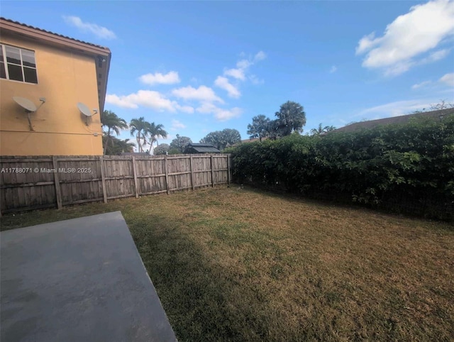view of yard featuring a patio and fence