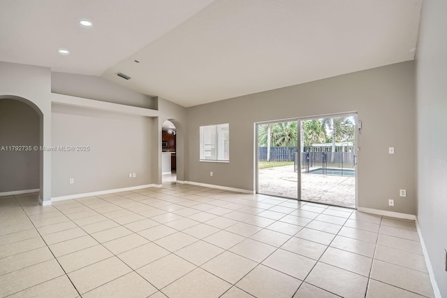 12846 SW 211th Ter, Miami, FL 33177 - unfurnished room featuring arched walkways, lofted ceiling, baseboards, light tile patterned floors, and recessed lighting