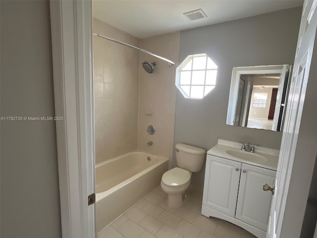 full bath with visible vents, bathtub / shower combination, tile patterned floors, vanity, and toilet