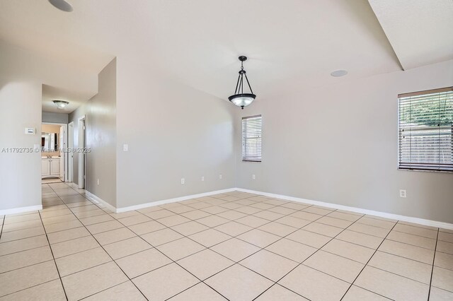 12846 SW 211th Ter, Miami, FL 33177 - spare room featuring light tile patterned floors, healthy amount of natural light, and baseboards