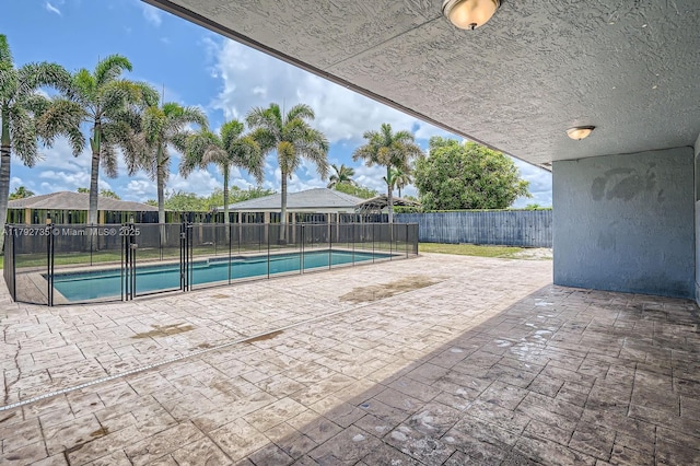 12846 SW 211th Ter, Miami, FL 33177 - view of swimming pool featuring a fenced backyard and a patio area