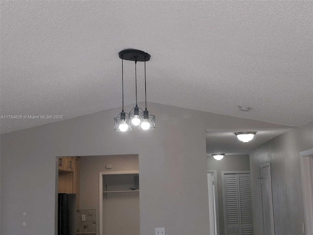 details featuring fridge and a textured ceiling