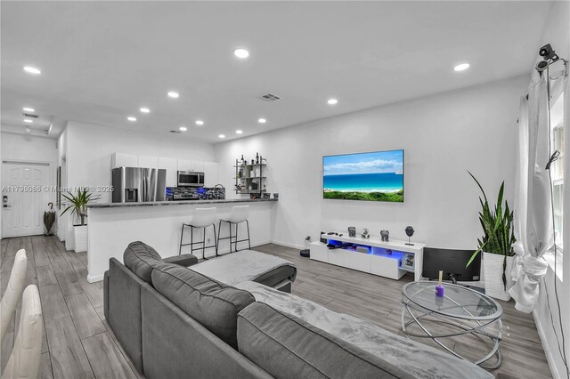2307 Washington St Unit 5, Hollywood, FL 33020 - living area featuring light wood finished floors and recessed lighting