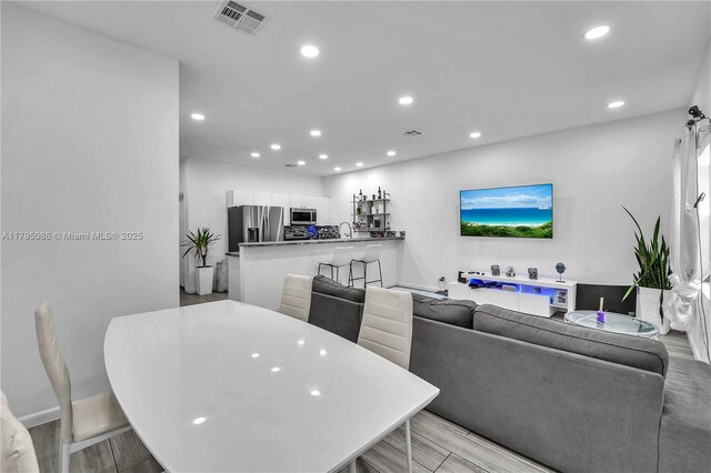 2307 Washington St Unit 5, Hollywood, FL 33020 - dining space with recessed lighting and light wood-style floors