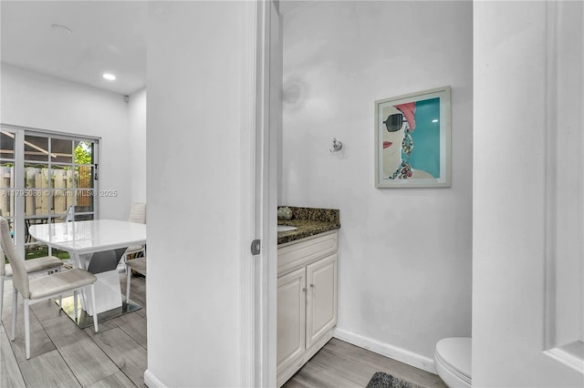 2307 Washington St Unit 5, Hollywood, FL 33020 - bathroom featuring vanity, wood finished floors, and recessed lighting