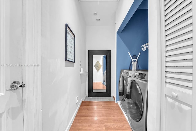 2307 Washington St Unit 5, Hollywood, FL 33020 - washroom with washing machine and clothes dryer and light wood-type flooring