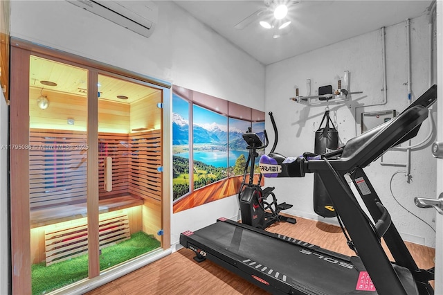 2307 Washington St Unit 5, Hollywood, FL 33020 - exercise room with a ceiling fan, wood finished floors, and a wall mounted air conditioner