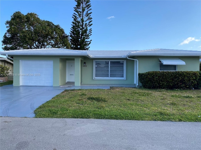 5009 NW 51st Ct, Tamarac, FL 33319 - ranch-style home with an attached garage, driveway, a front lawn, and stucco siding