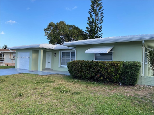 5009 NW 51st Ct, Tamarac, FL 33319 - ranch-style home featuring a garage, stucco siding, and a front yard