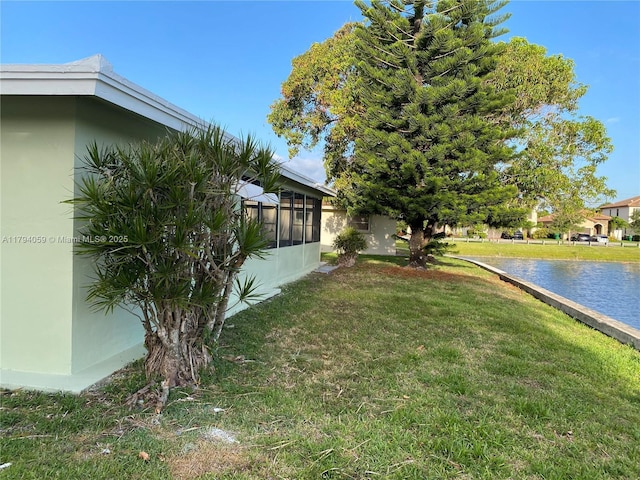 5009 NW 51st Ct, Tamarac, FL 33319 - view of yard featuring a water view and a sunroom