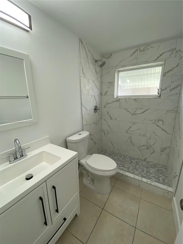 5009 NW 51st Ct, Tamarac, FL 33319 - bathroom featuring toilet, a shower stall, tile patterned flooring, and vanity
