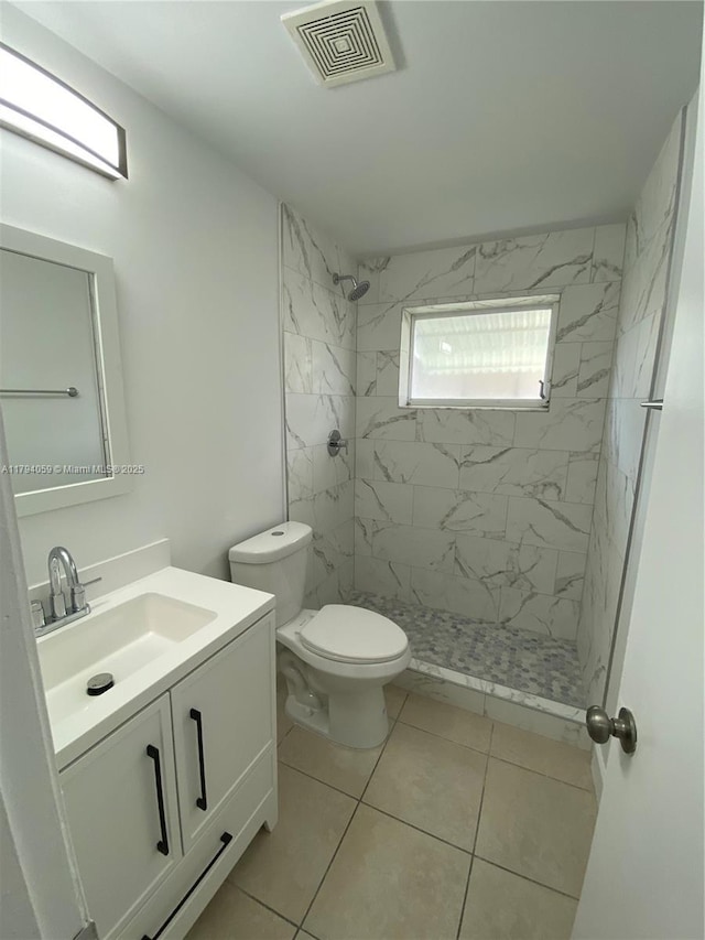5009 NW 51st Ct, Tamarac, FL 33319 - full bath with tile patterned flooring, vanity, toilet, visible vents, and a stall shower