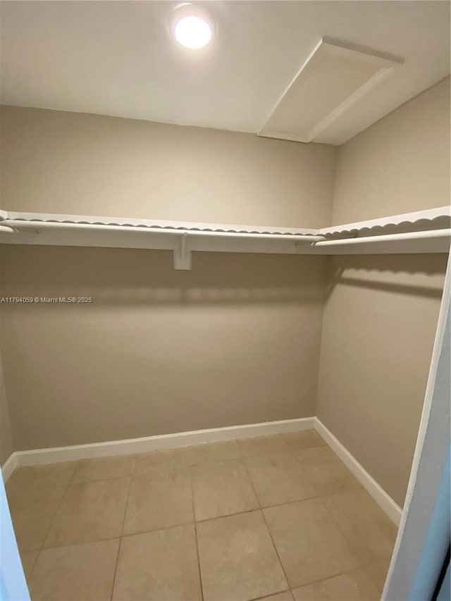 5009 NW 51st Ct, Tamarac, FL 33319 - spacious closet with light tile patterned flooring