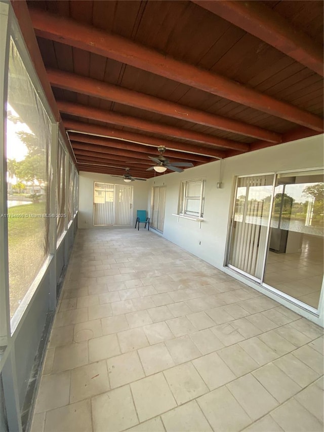 5009 NW 51st Ct, Tamarac, FL 33319 - unfurnished sunroom with ceiling fan and beamed ceiling