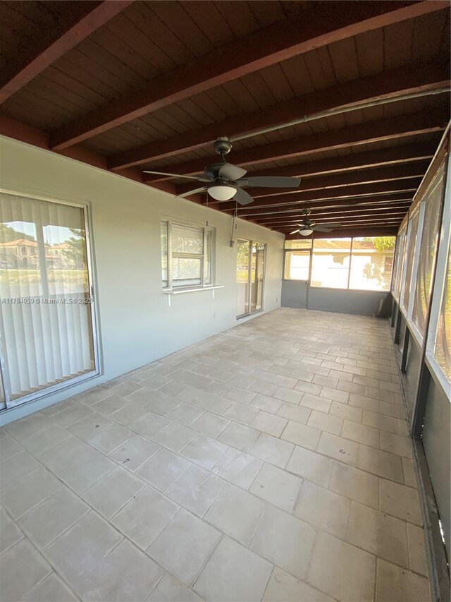 5009 NW 51st Ct, Tamarac, FL 33319 - unfurnished sunroom featuring a ceiling fan and beamed ceiling