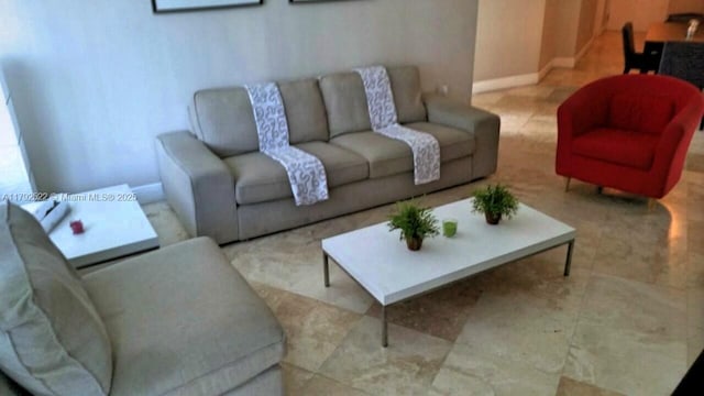 living room featuring baseboards