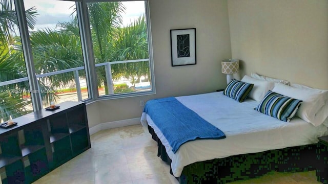 bedroom featuring baseboards