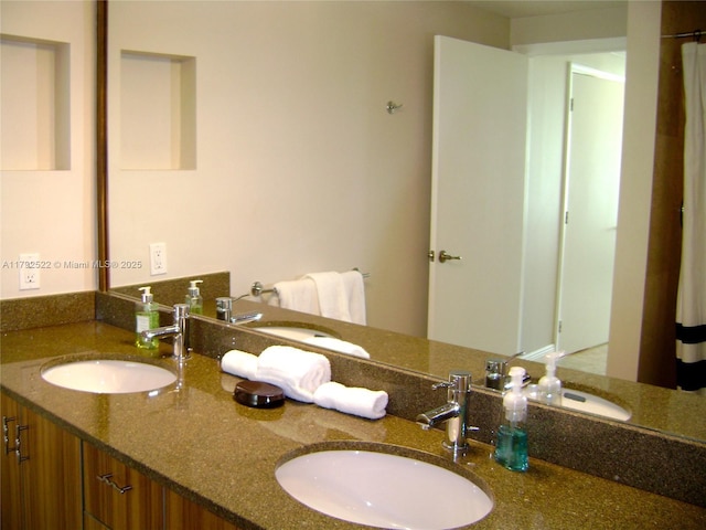 bathroom with double vanity and a sink