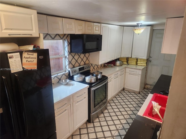 9407 NW 4th Ave, Miami, FL 33150 - kitchen featuring light floors, light countertops, white cabinets, tasteful backsplash, and black appliances
