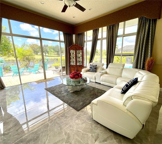 12022 Classic Dr, Coral Springs, FL 33071 - living room with ceiling fan and a textured ceiling