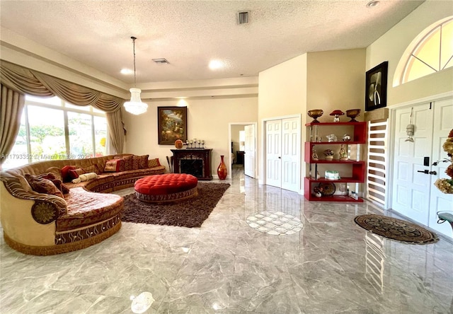 12022 Classic Dr, Coral Springs, FL 33071 - living room with marble tiled flooring and a textured ceiling