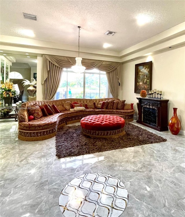 12022 Classic Dr, Coral Springs, FL 33071 - living area featuring a textured ceiling, marble tiled floors, and a fireplace
