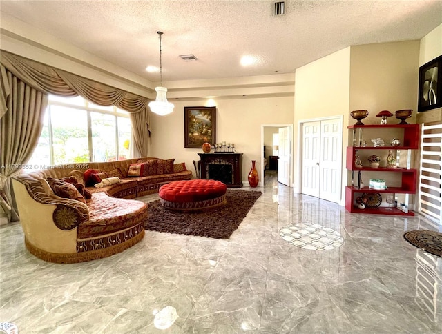 12022 Classic Dr, Coral Springs, FL 33071 - living room with marble tiled flooring, a textured ceiling, and a fireplace