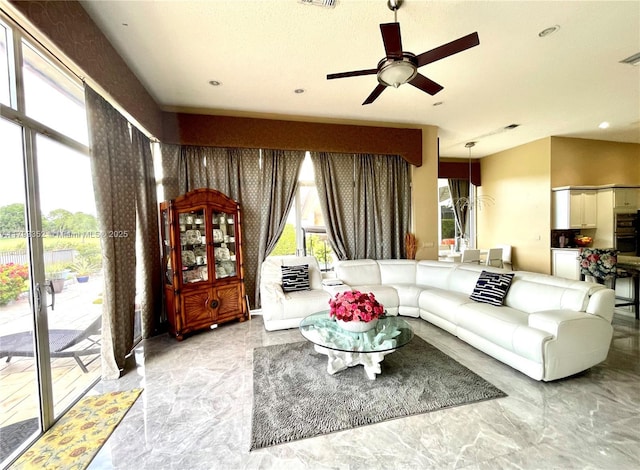 12022 Classic Dr, Coral Springs, FL 33071 - living room featuring marble tiled floors, ceiling fan, and recessed lighting