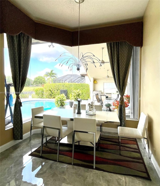 12022 Classic Dr, Coral Springs, FL 33071 - dining room featuring concrete floors and a textured ceiling