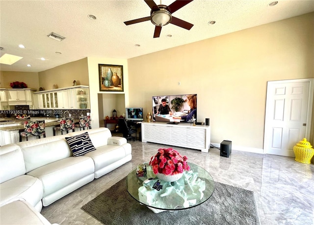 12022 Classic Dr, Coral Springs, FL 33071 - living room with a ceiling fan, light marble finish flooring, recessed lighting, and a textured ceiling