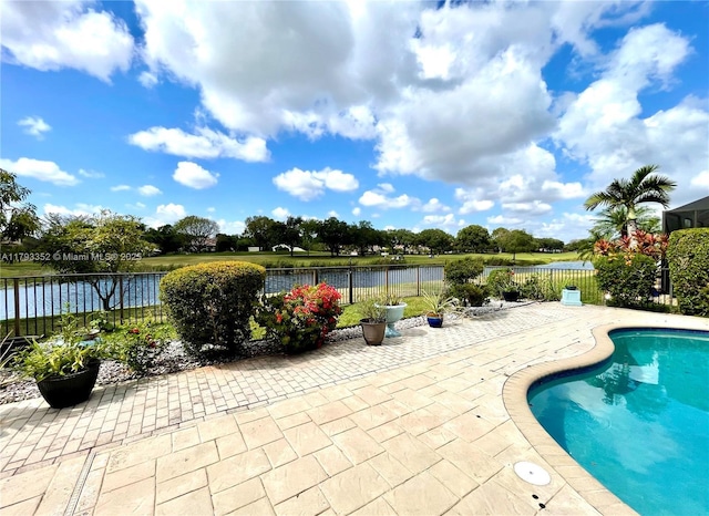 12022 Classic Dr, Coral Springs, FL 33071 - view of pool featuring a patio, a fenced backyard, and a water view